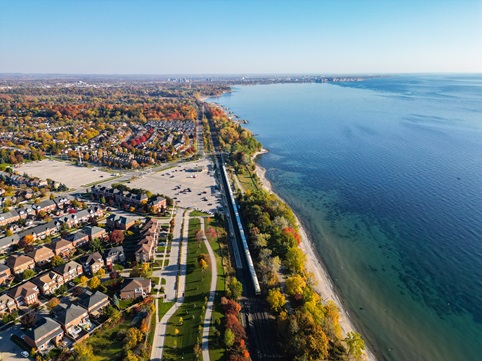 Transit near houses and a lake